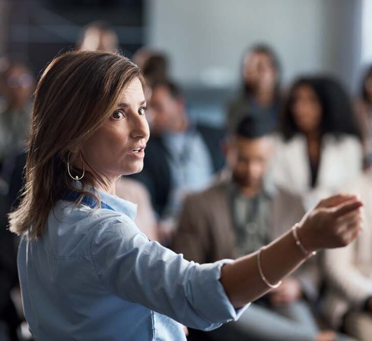 businesswoman delivering a presentation at a conference