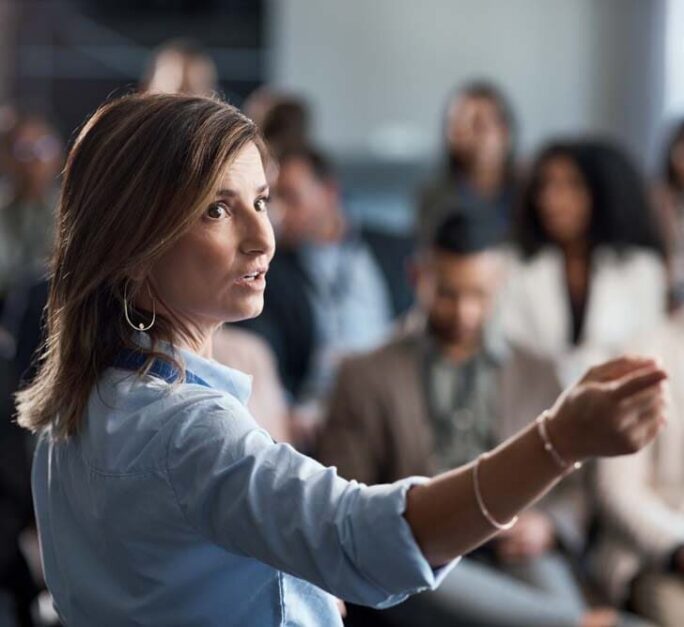 businesswoman delivering a presentation at a conference